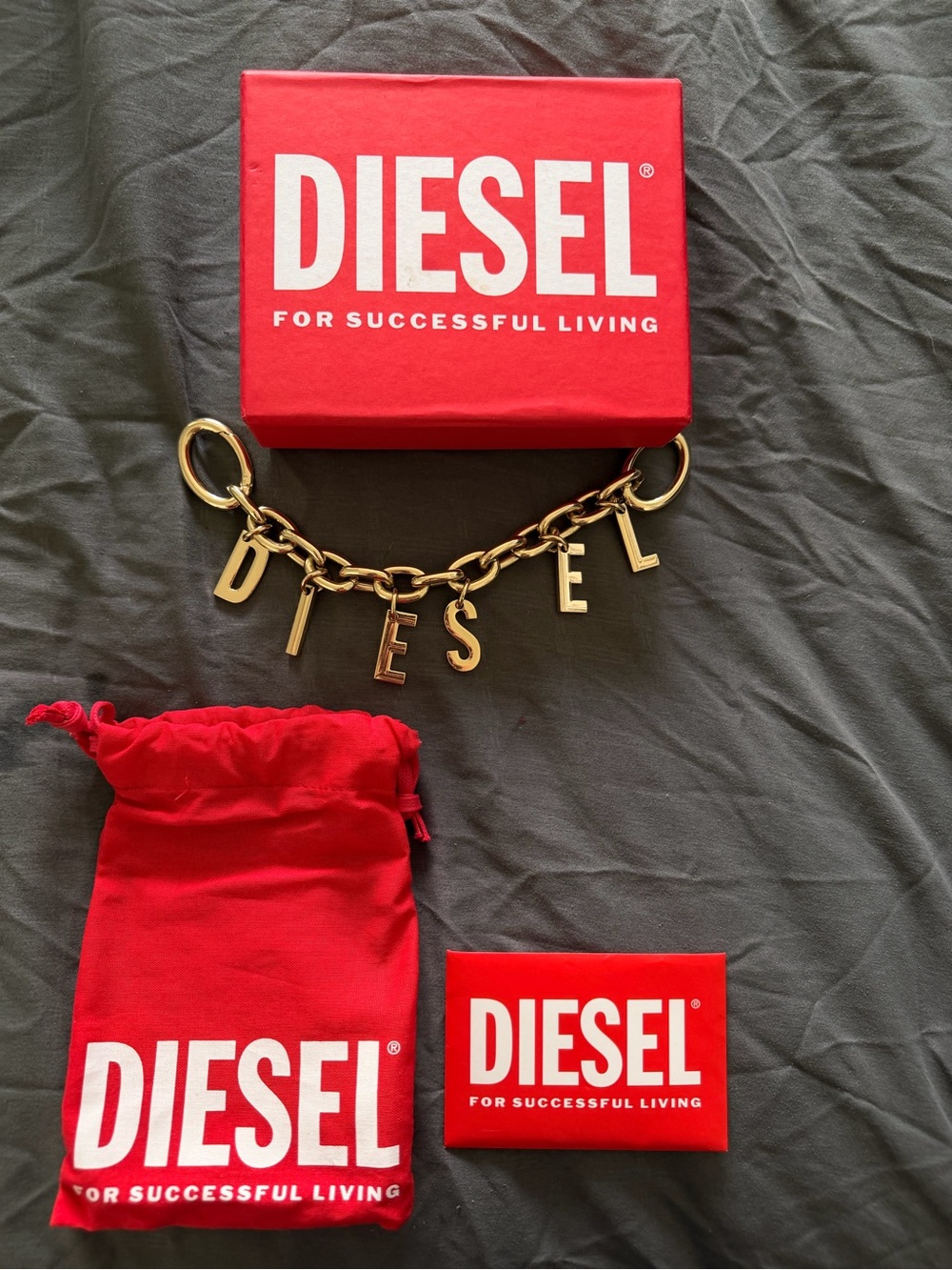Diesel Gold-Tone Letter Charm Bracelet with Red Branded Pouch & Box